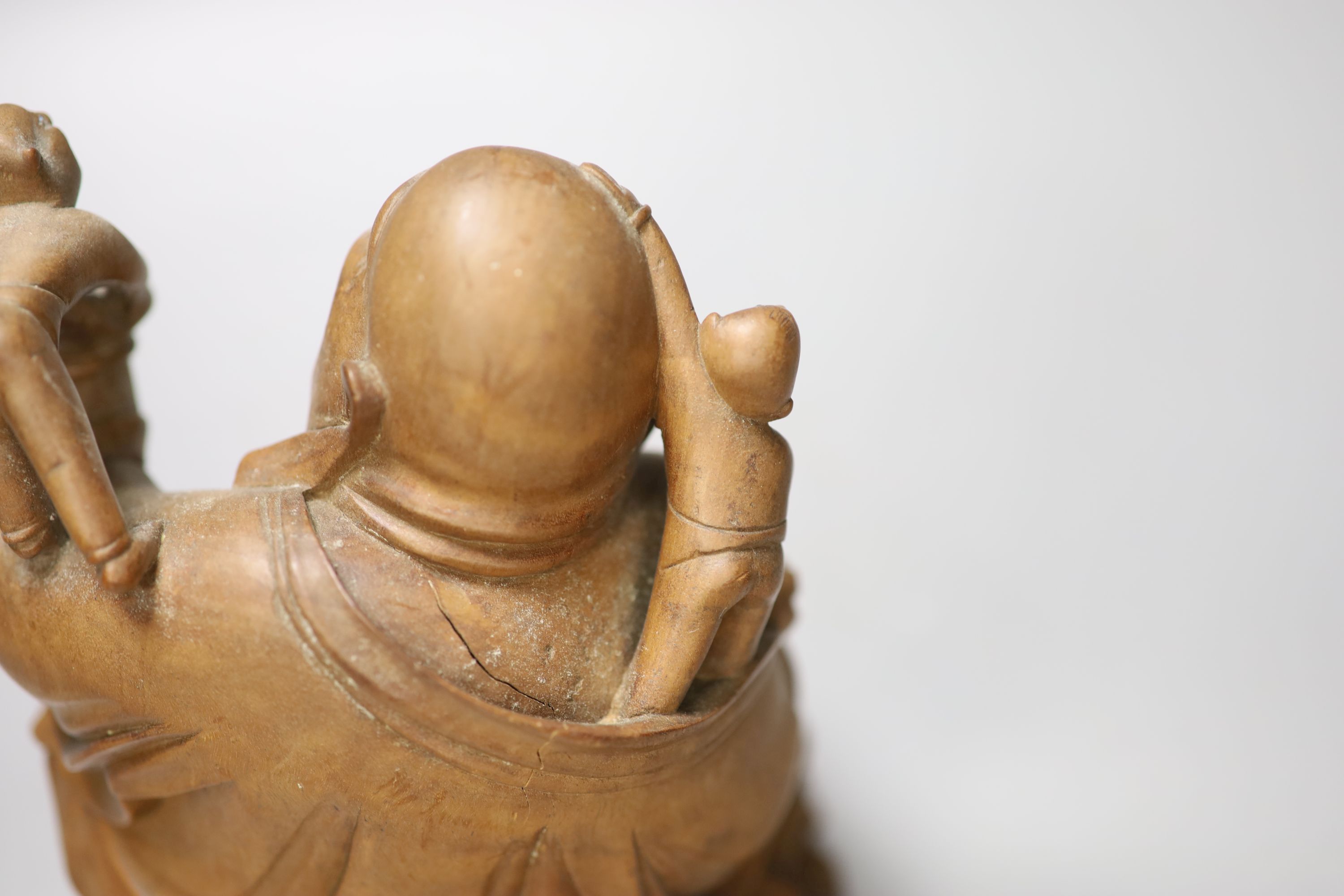 A Chinese carved hardwood figure of Budai, height 17cm
